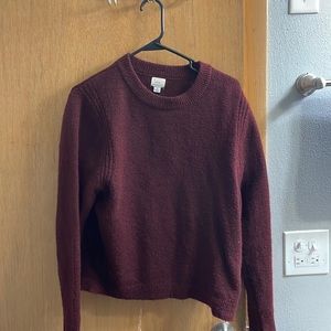 A New Day red sweater.